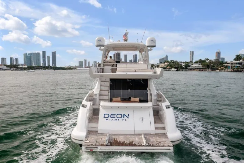 Slide: The Image of Azimut 64 Flybridge 2014 yacht cruising in Miami waters with city skyline in background. - 12