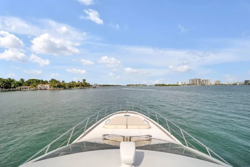Slide: The Image of Bow view of 2014 Azimut 64 Flybridge yacht cruising on a sunny day. - 18