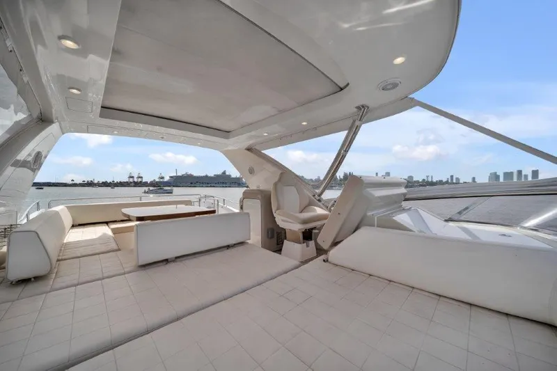 Slide: The Image of Luxurious 2014 Azimut 64 Flybridge yacht interior with spacious seating and scenic ocean view. - 19