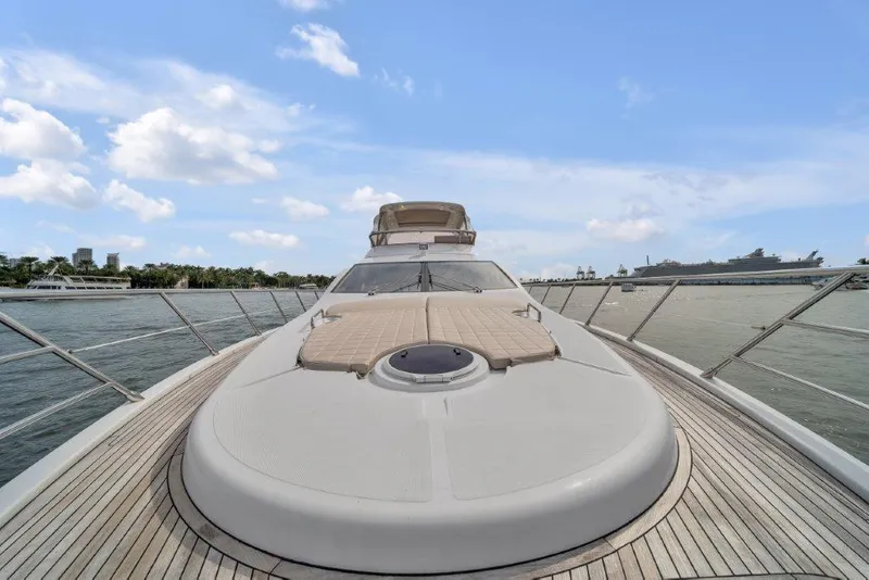 Slide: The Image of Azimut 64 Flybridge 2014 yacht on water, showcasing sleek deck and luxurious design. - 20