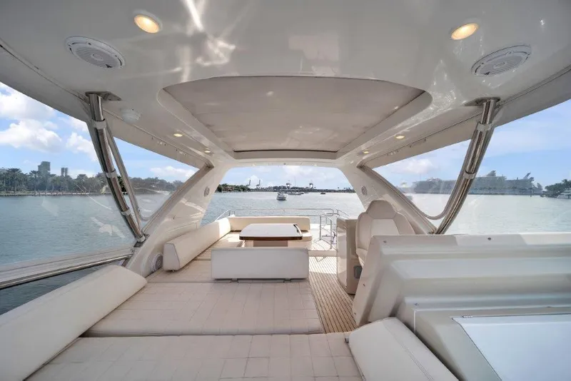 Slide: The Image of Luxurious 2014 Azimut 64 Flybridge yacht interior with spacious seating and scenic water views. - 24