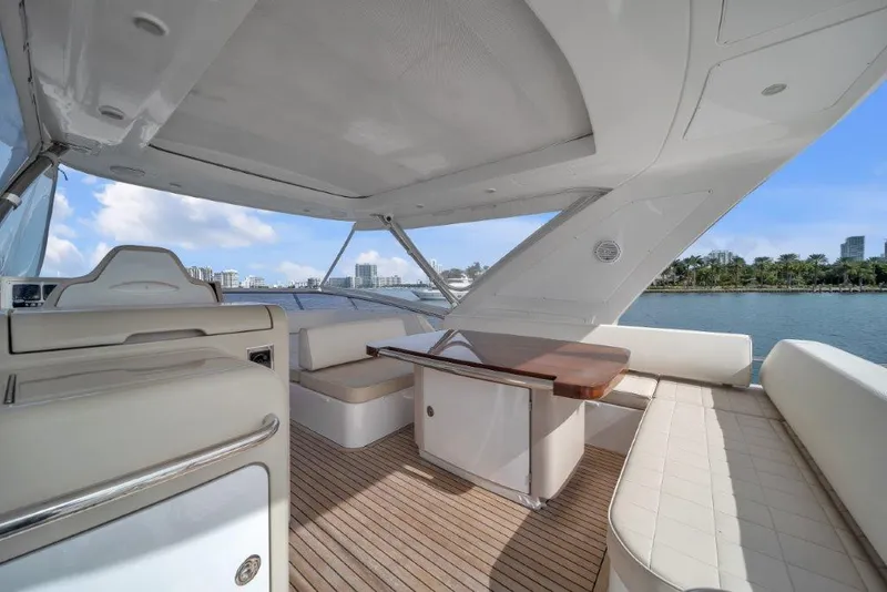 Slide: The Image of Luxurious 2014 Azimut 64 Flybridge yacht interior with elegant seating and wooden table. - 25