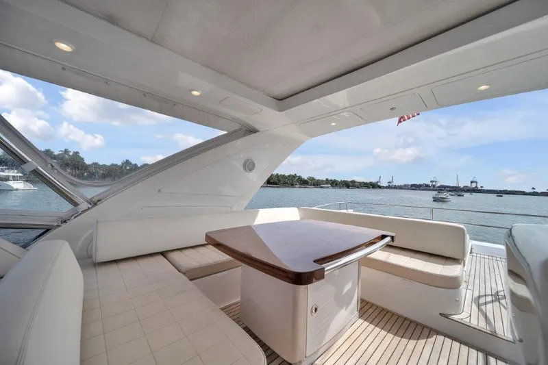 Slide: The Image of Luxurious 2014 Azimut 64 Flybridge yacht with elegant seating and scenic ocean view. - 29