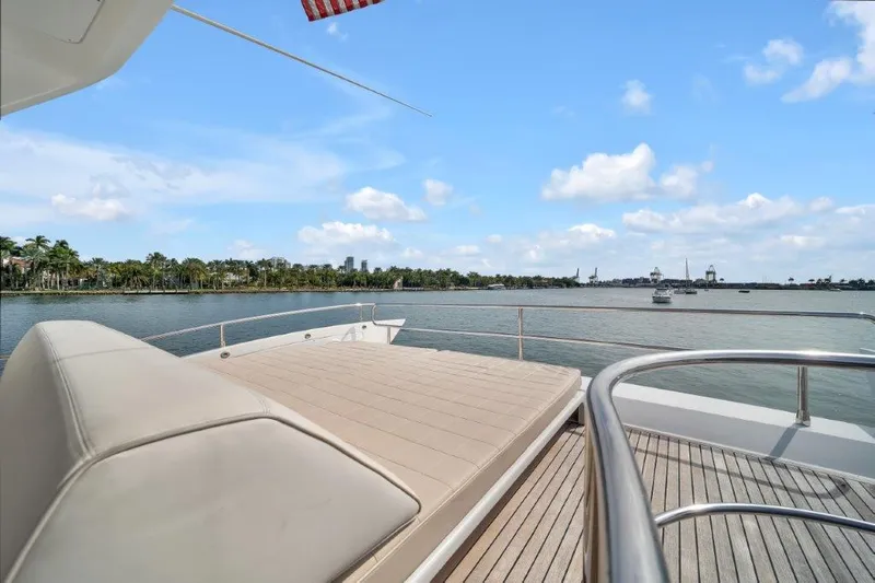 Slide: The Image of Luxurious 2014 Azimut 64 Flybridge yacht deck with scenic waterfront view. - 30