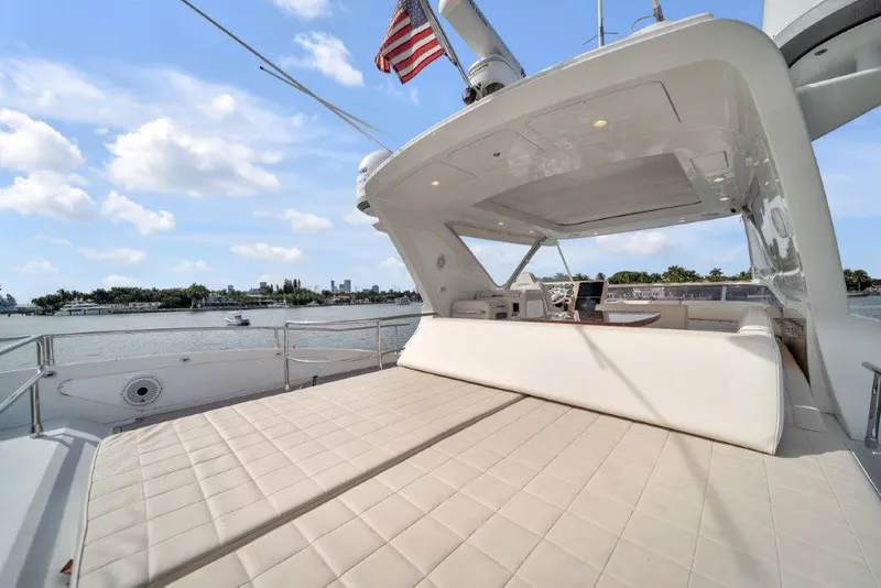Slide: The Image of Luxurious 2014 Azimut 64 Flybridge yacht with spacious deck and scenic water view. - 34