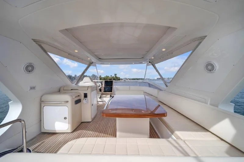 Slide: The Image of Luxurious 2014 Azimut 64 Flybridge yacht interior with elegant seating and ocean view. - 35