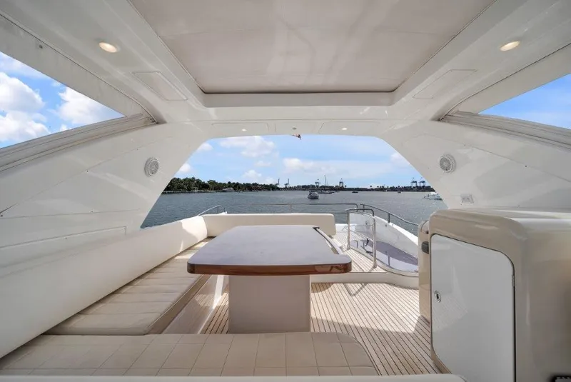 Slide: The Image of Luxurious 2014 Azimut 64 Flybridge yacht interior with elegant seating and scenic water view. - 36