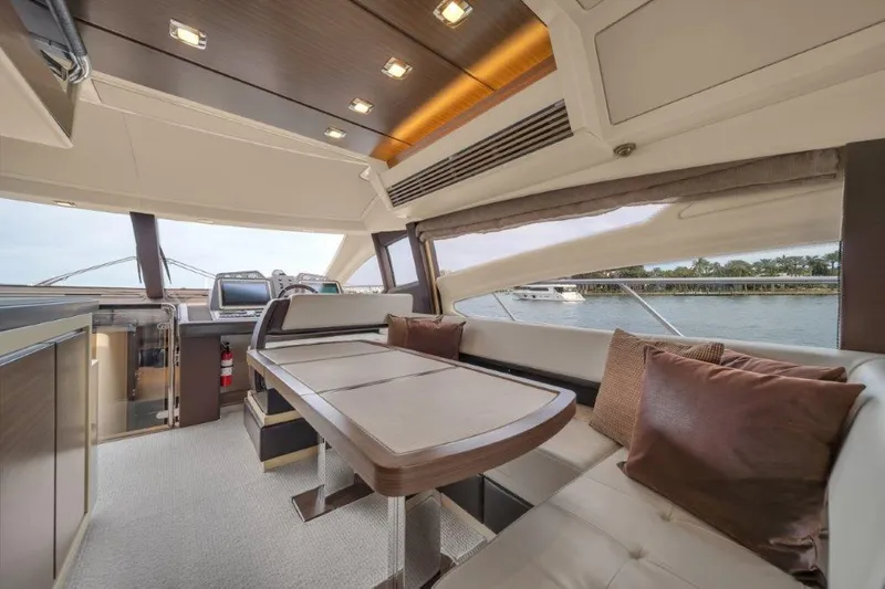 Slide: The Image of Luxurious interior of 2014 Azimut 64 Flybridge yacht with elegant seating and dining area. - 37