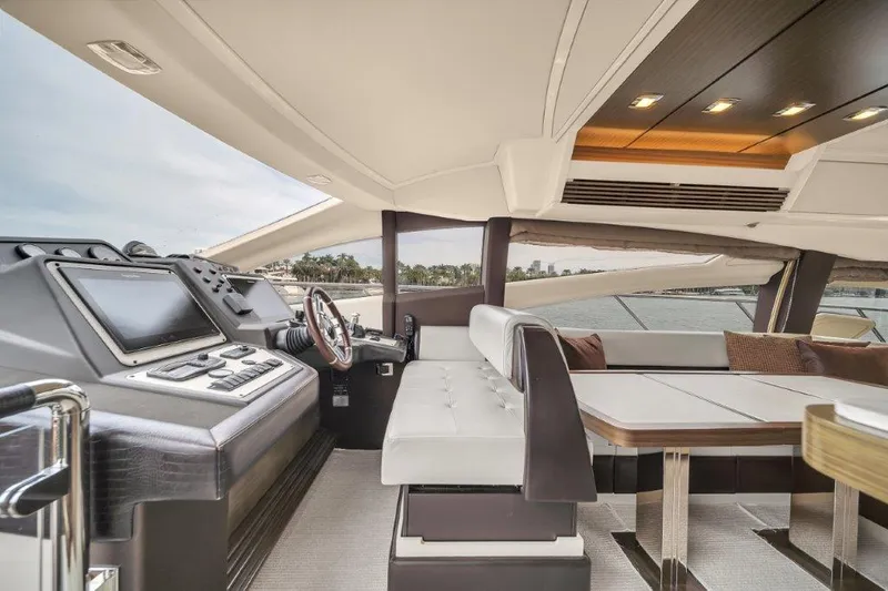 Slide: The Image of 2014 Azimut 64 Flybridge yacht interior with modern helm and luxurious seating. - 38