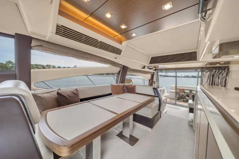 Slide: The Image of Luxurious interior of 2014 Azimut 64 Flybridge yacht with elegant dining area. - 39