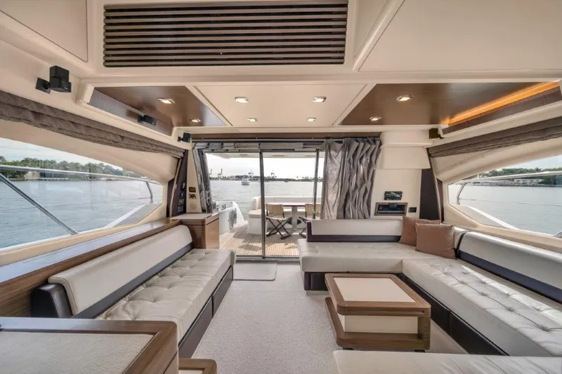 Slide: The Image of Luxurious interior of 2014 Azimut 64 Flybridge yacht with elegant seating and scenic water views. - 42