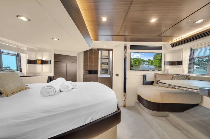 Slide: The Image of Luxurious interior of 2014 Azimut 64 Flybridge yacht with elegant bedroom and scenic window view. - 43