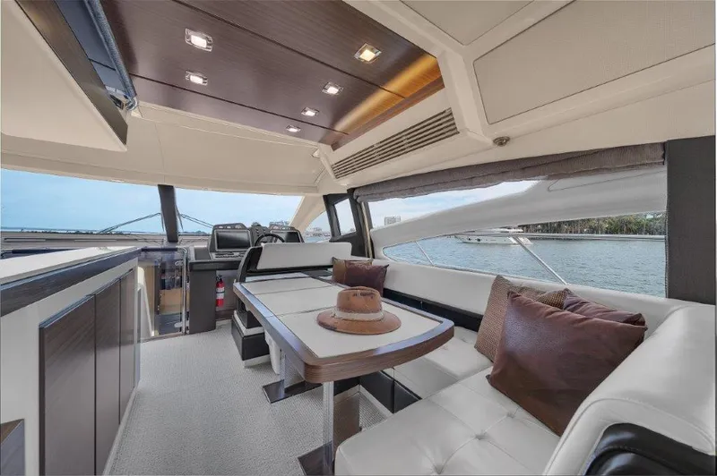 Slide: The Image of Luxurious interior of 2014 Azimut 64 Flybridge yacht with elegant seating and scenic views. - 46