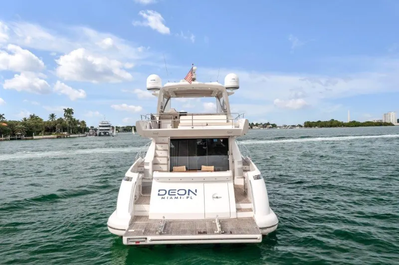 Slide: The Image of Azimut 64 Flybridge 2014 yacht on water, rear view, clear sky, Miami. - 7