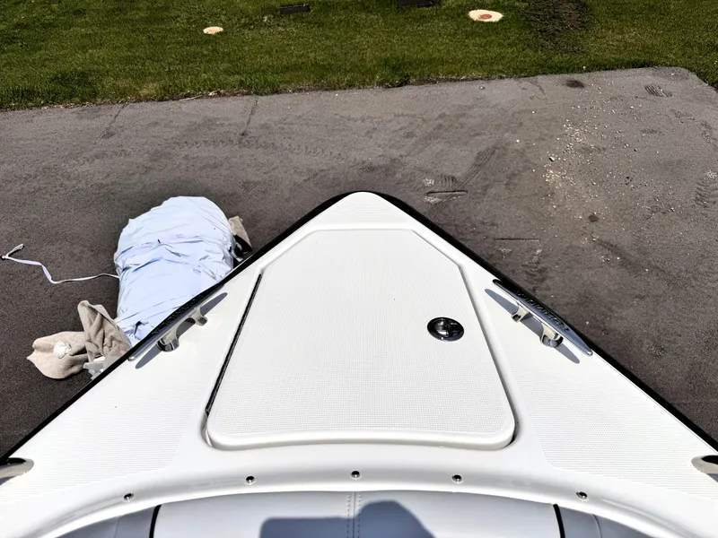 Slide: The Image of Bow of 2026 Formula 290 Bowrider on pavement, with cover nearby. - 18