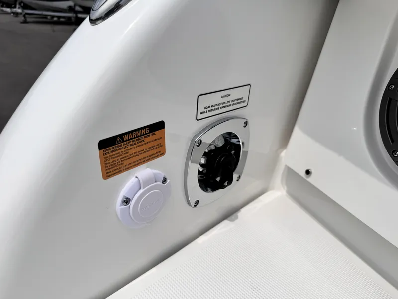 Slide: The Image of 2026 Formula 290 Bowrider fuel cap and warning labels on white hull. - 25