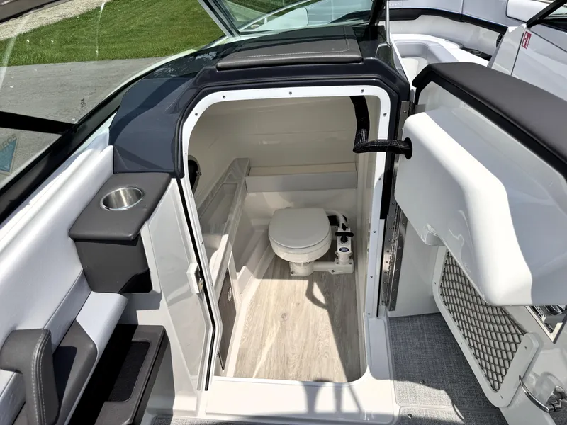 Slide: The Image of 2026 Formula 290 Bowrider boat interior with compact bathroom and modern design. - 35