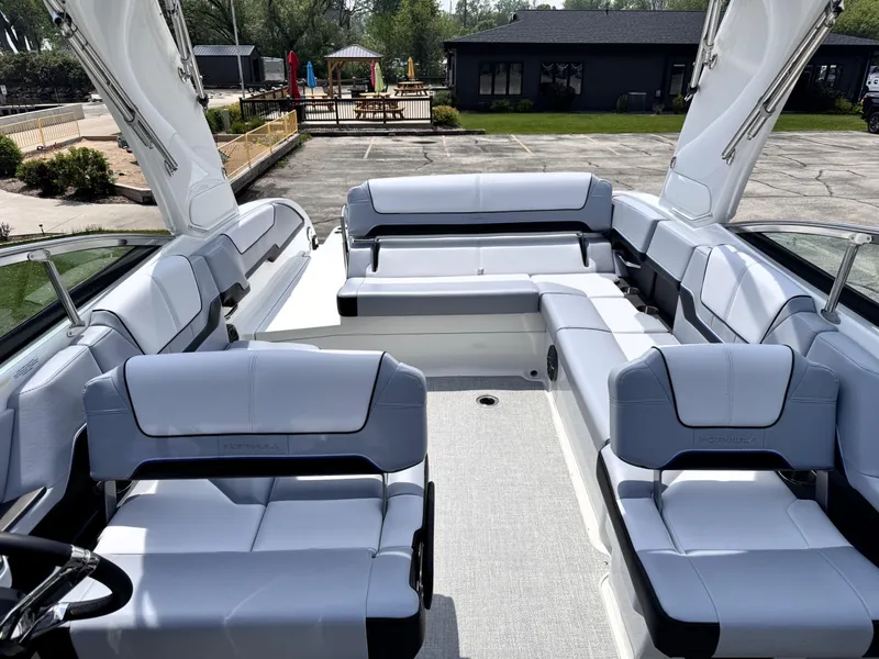 Slide: The Image of 2026 Formula 290 Bowrider with spacious seating and modern design in a marina setting. - 7