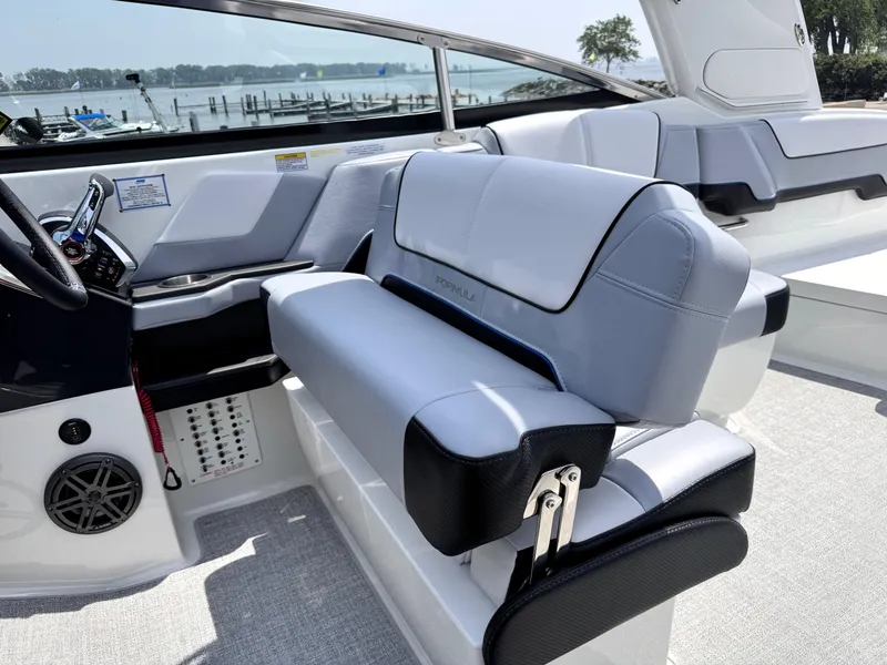 Slide: The Image of 2026 Formula 290 Bowrider interior with sleek seating and modern design by the waterfront. - 8