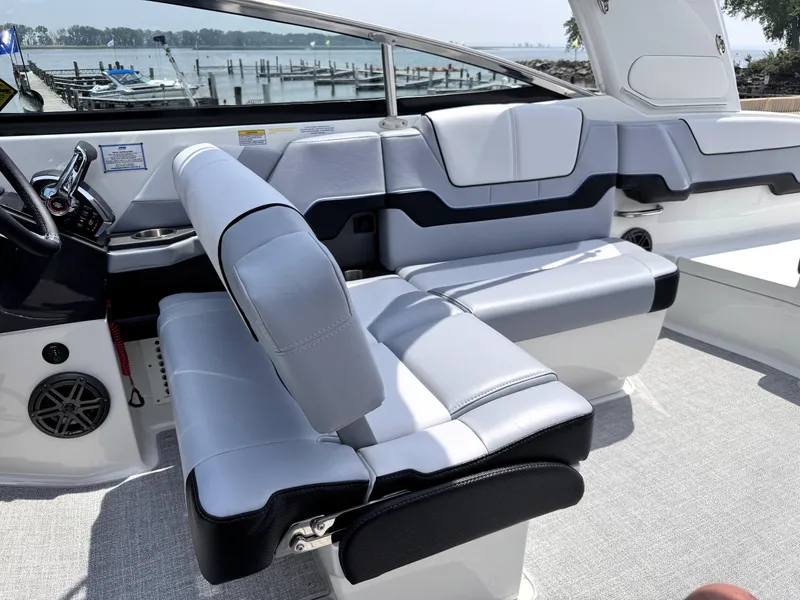 Slide: The Image of 2026 Formula 290 Bowrider interior with sleek seating and waterfront view. - 9