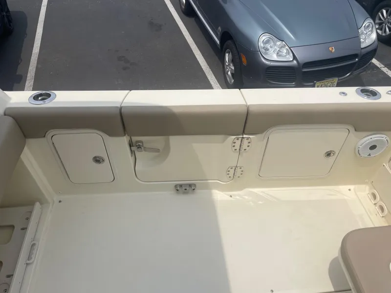 Slide: The Image of 2023 Chris-Craft Calypso 28 boat interior with storage compartments and seating. - 19