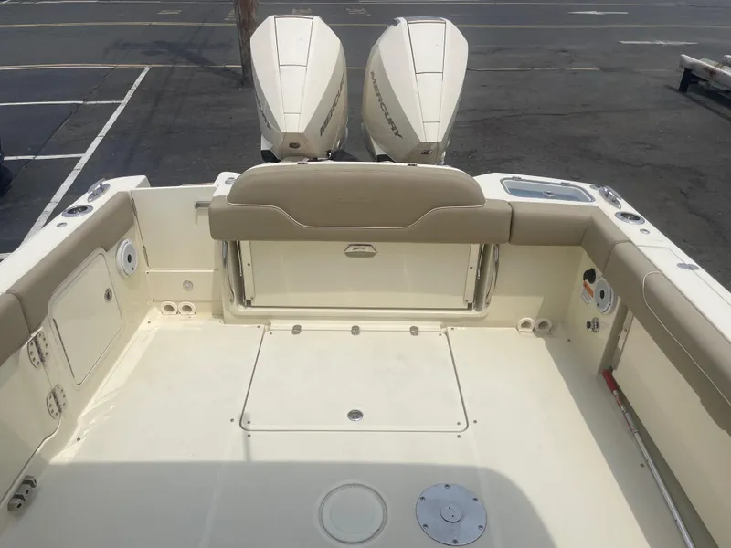 Slide: The Image of 2023 Chris-Craft Calypso 28 boat deck with twin outboard engines. - 22
