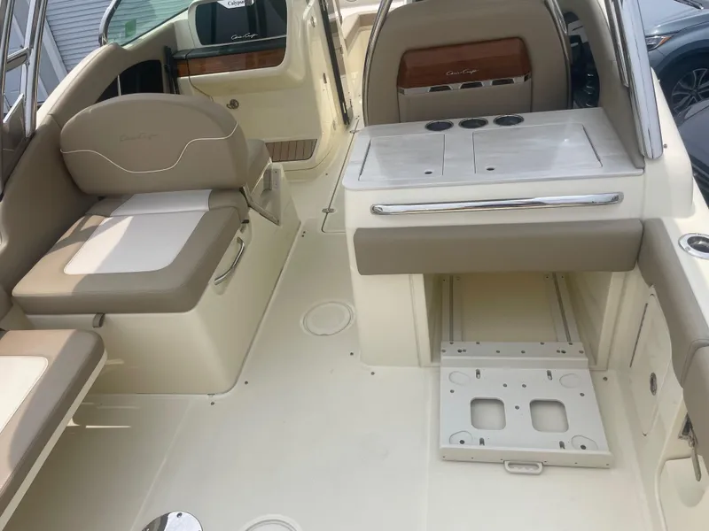 Slide: The Image of 2023 Chris-Craft Calypso 28 interior with beige seating and sleek design. - 28