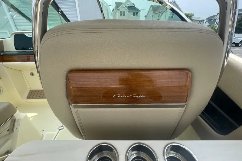Slide: The Image of 2023 Chris-Craft Calypso 28 boat interior with elegant wood and leather detailing. - 32
