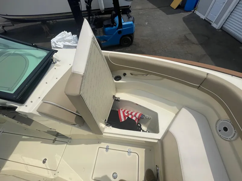 Slide: The Image of 2023 Chris-Craft Calypso 28 boat interior with seating and storage compartment. - 50