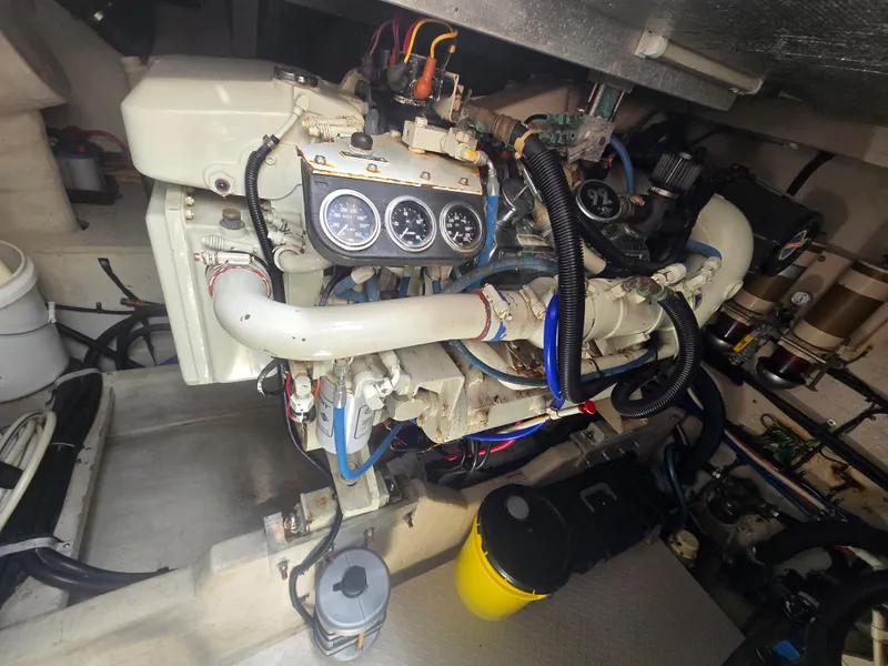 Slide: The Image of Engine room of 1998 Sea Ray 500 Sundancer with visible gauges and components. - 26