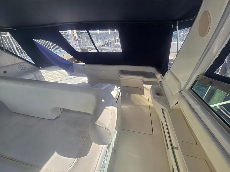Slide: The Image of Interior of 1998 Sea Ray 500 Sundancer yacht, featuring spacious seating and elegant design. - 9
