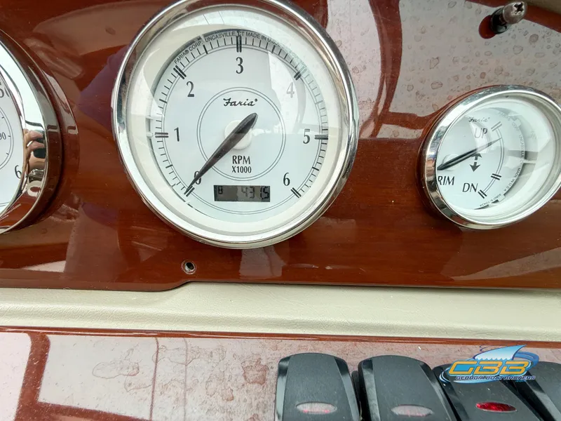 Slide: The Image of Dashboard of a 2010 Regal 2300 Bowrider showing RPM gauges. - 14