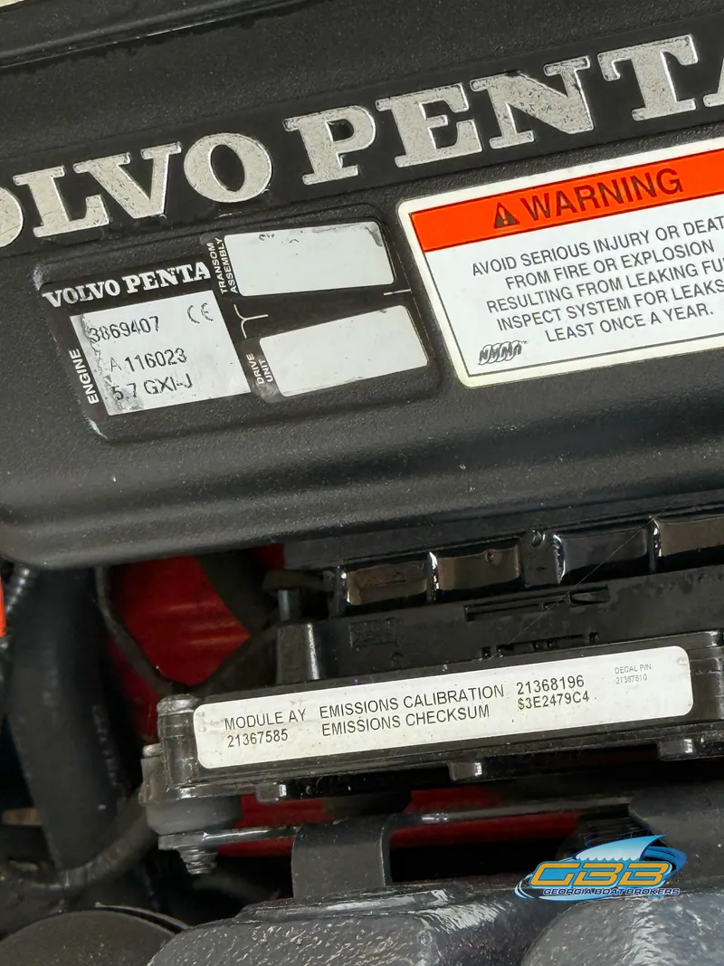 Slide: The Image of Volvo Penta engine in a 2010 Regal 2300 Bowrider with warning labels visible. - 17