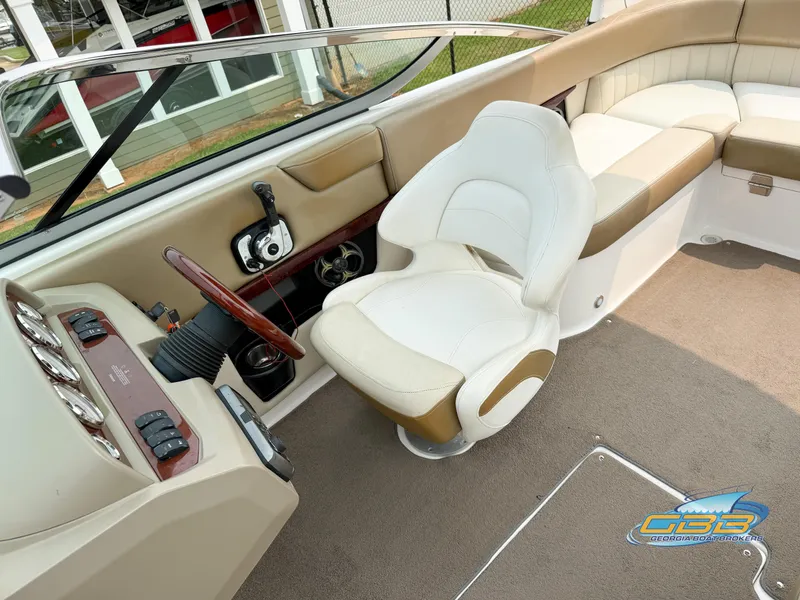 Slide: The Image of 2010 Regal 2300 Bowrider interior with captain's chair and dashboard controls. - 8
