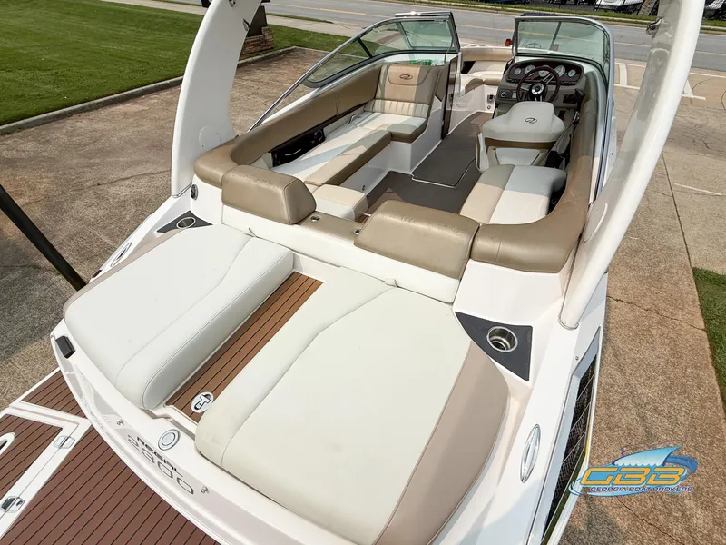 Slide: The Image of 2010 Regal 2300 Bowrider boat with spacious seating and modern design. - 9