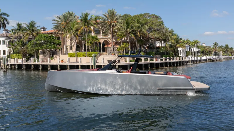 The Image of Luxury 2022 Pardo Yachts Pardo 43 cruising near waterfront homes, under a clear blue sky. - 0