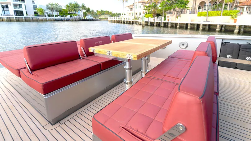 Slide: The Image of 2022 Pardo Yachts Pardo 43 with red seating and wooden table on deck. - 18
