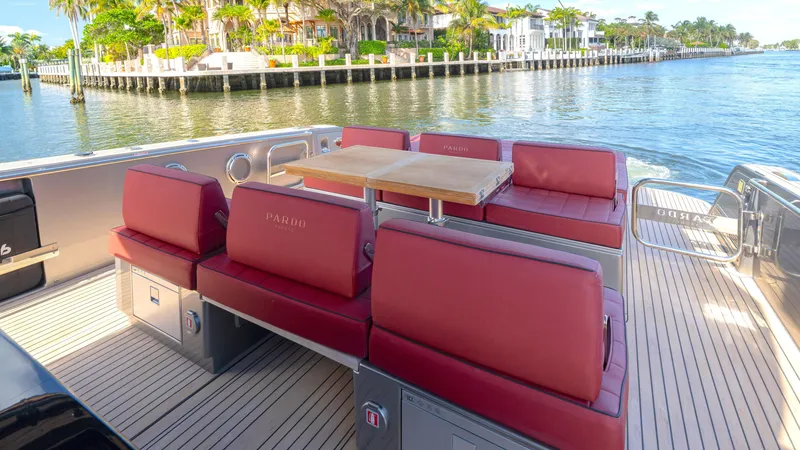 Slide: The Image of Luxury seating area on 2022 Pardo Yachts Pardo 43, with waterfront view. - 26