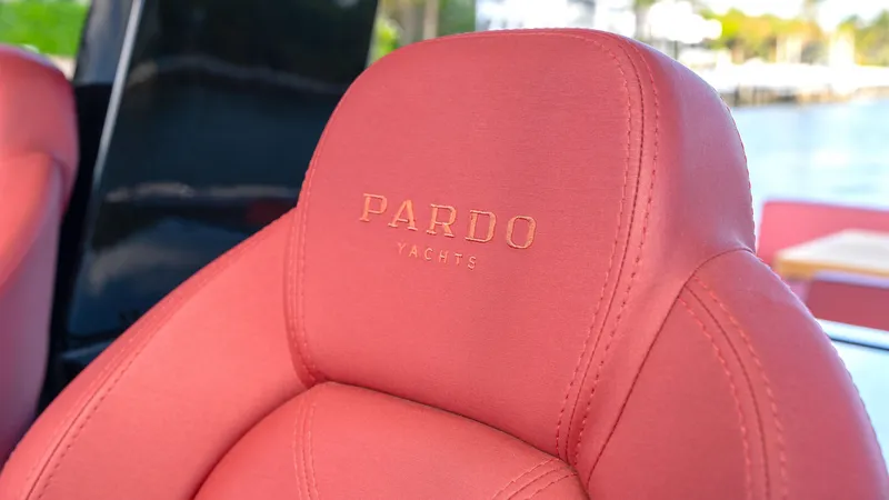 Slide: The Image of Red leather seat with "Pardo Yachts" logo on a 2022 Pardo 43 yacht. - 29