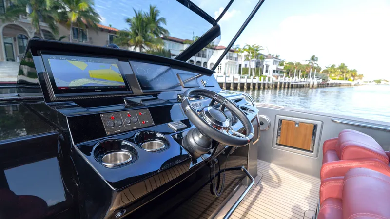 Slide: The Image of Helm of 2022 Pardo Yachts Pardo 43 with modern controls and waterfront view. - 31