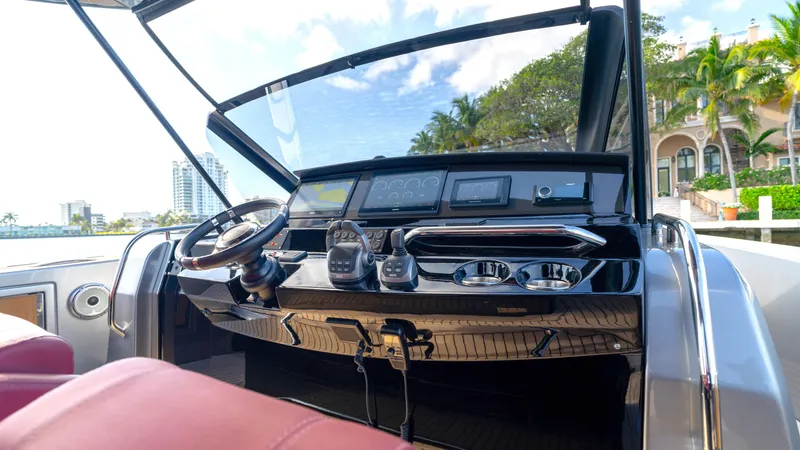 Slide: The Image of Helm of 2022 Pardo Yachts Pardo 43 with modern controls and waterfront view. - 35