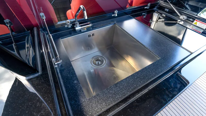 Slide: The Image of Stainless steel sink on 2022 Pardo Yachts Pardo 43, featuring sleek black countertop. - 22