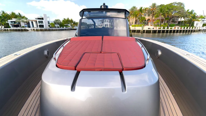 Slide: The Image of 2022 Pardo Yachts Pardo 43 with red sunbed, docked by waterfront homes. - 37