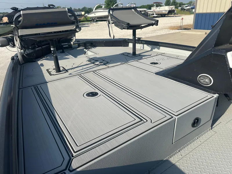 Slide: The Image of 2025 SeaArk Flex 19 boat interior with seating and storage compartments. - 6