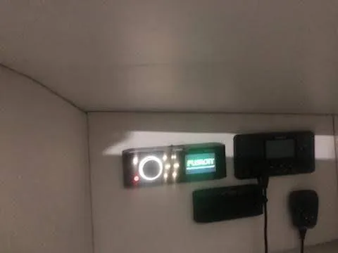 Slide: The Image of Control panel inside 2019 Midnight Express 39 Cuddy boat, featuring electronic displays and controls. - 13