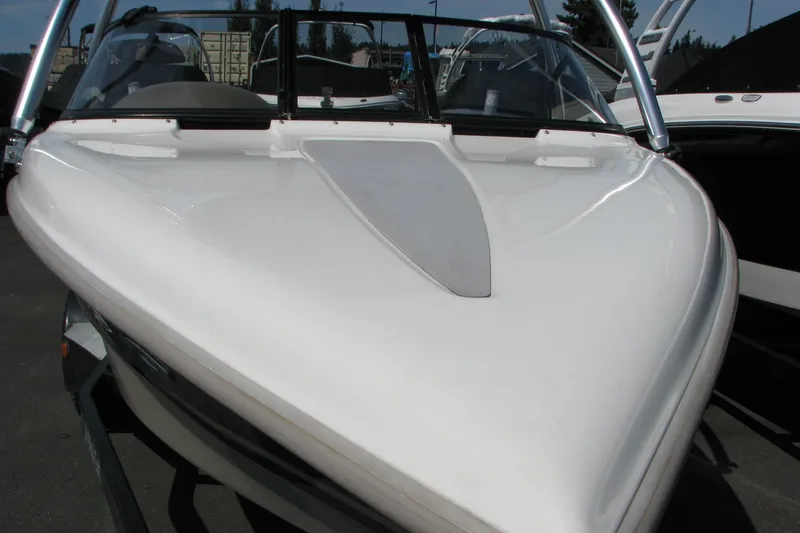 Slide: The Image of 2001 Tigé 20ci boat, white hull, sleek design, parked outdoors. - 15