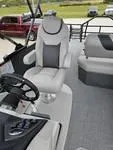 Slide: The Image of 2025 Sylvan L-3 DLZ boat interior with steering wheel and seating. - 14