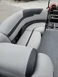 Slide: The Image of 2025 Sylvan L-3 DLZ boat interior with gray cushioned seating. - 16