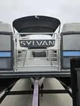 Slide: The Image of 2025 Sylvan L-3 DLZ pontoon boat with canopy and railing, viewed from the rear. - 7