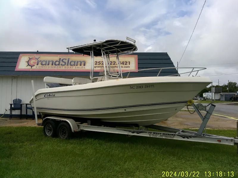 Slide: The Image of 2007 Cobia 214 Center Console boat with Yamaha engine on trailer. - 1